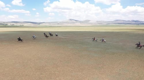 Horses And Men In Javelin Game With Aerial View