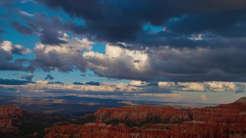 Dramatic Canyon Landscape Under a Cloudy Sky at Sunrise