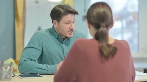 Man Talking in an Office Setting