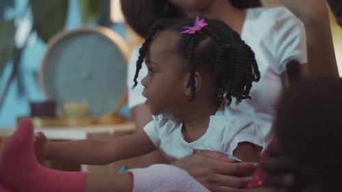 Loving Mother Cares for Child at Home