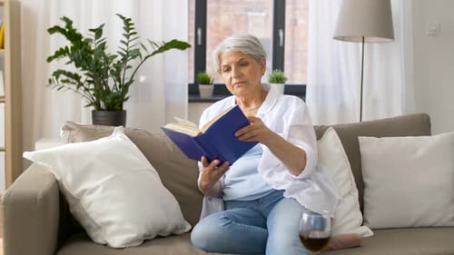 Senior Woman Reading at Home Leisure