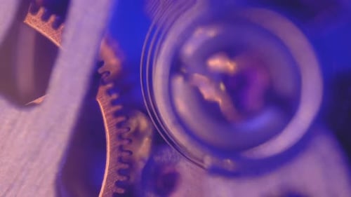 Macro Footage of Clock Gears Moving in Blue Light