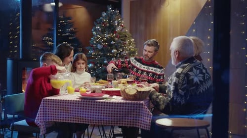 Family Celebrates Christmas Dinner at Home