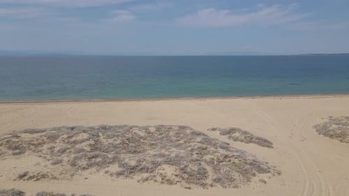 4k moving forward clip over a peninsula on the tropical beach of Epanomi, Halkidiki, Greece