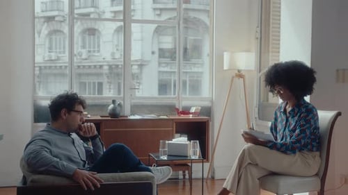 Man Talking To Woman in an Urban Apartment