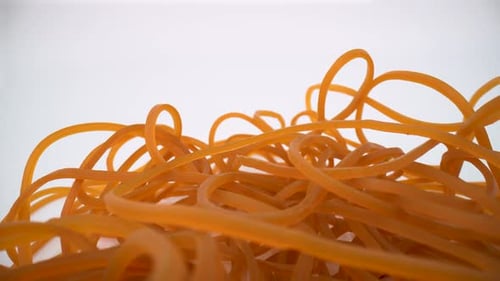 Rubber bands macro on white background isolated 4K