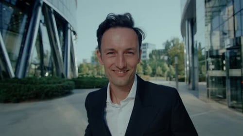 Happy business man walking with joy.