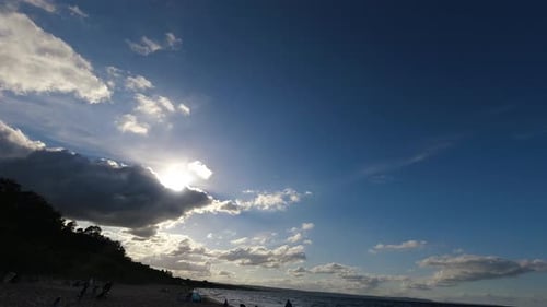 Sunny Day at Beach with Clouds