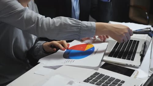 Analyzing Pie Chart in Modern Office Setting