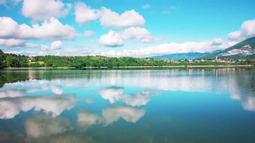 Timelapse of Clouds over a Lake at Midday
