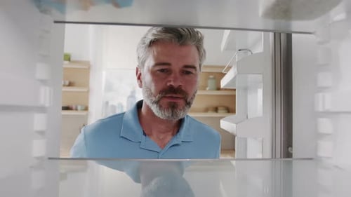 Man Takes Sandwich From Empty Refrigerator Inside
