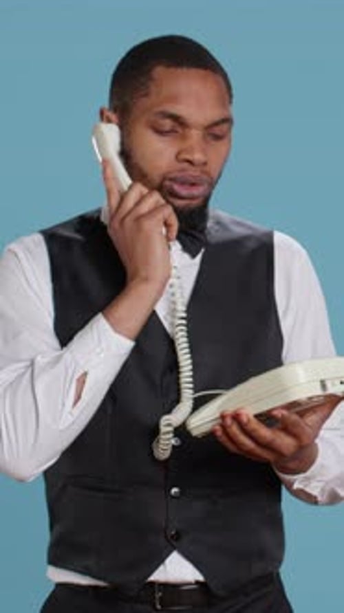 Professional Waiter Answering Retro Landline Phone Call