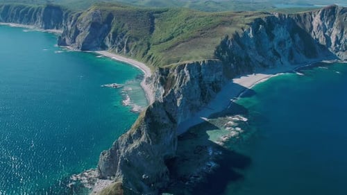 Aerial Panoramic View of Cliffs and Huge Rocks at Seaside and Waves Crashing to the Coast Beautiful