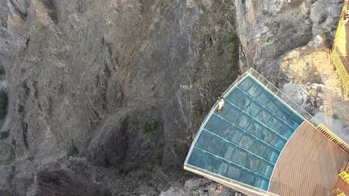 Aerial View Of Couple Enjoy A Scenery From The Glass Terrace