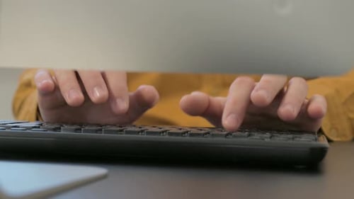 Close up of Male Hands Typing on Keyboard