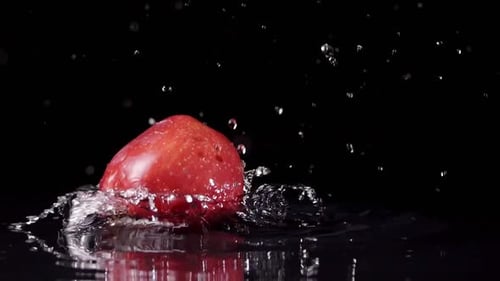 Apple Splas rojo en cámara lenta