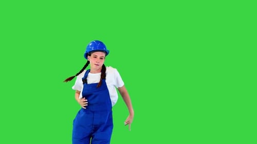 Young Female Construction Worker Dancing on a Green Screen Chroma Key