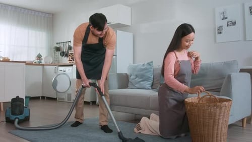 Couple Cleaning Together in Modern Home