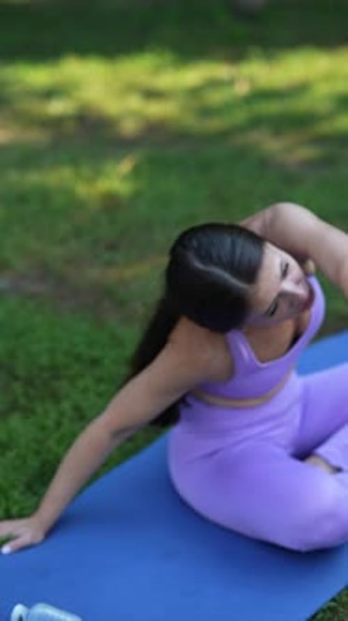 Engaging in a Collective Yoga Practice in the Park on a Summer Day