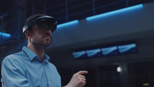 In 3D Content Creating Laboratory Engineer Wearing Professional Virtual Reality Headset Works and G