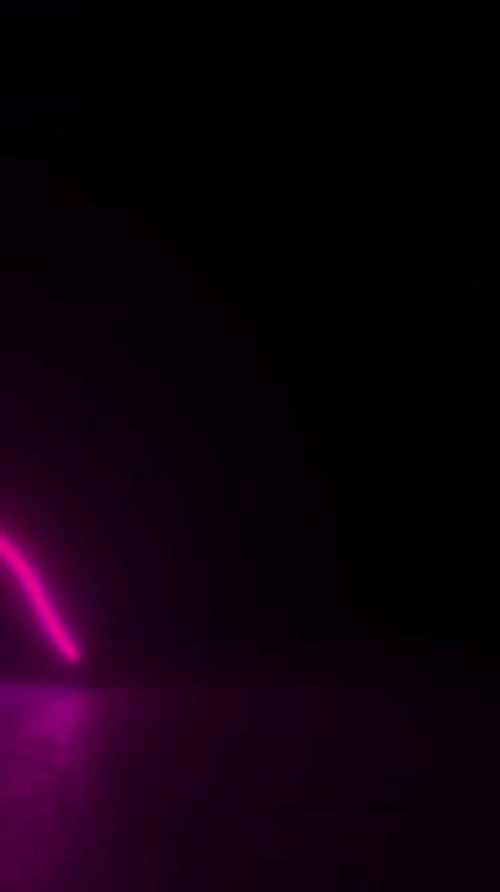 Dynamic red and yellow neon lights emit from a black background in a futuristic 3D animation loop.