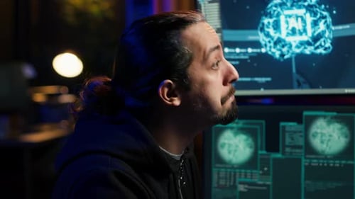 Hacker Using AI Machine Learning on Computer to Produce Malware Corrupting Data