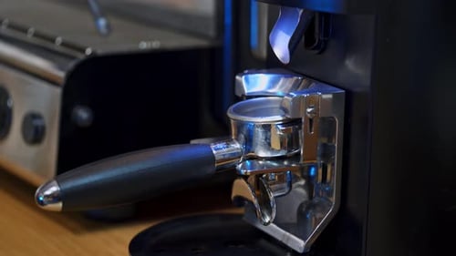 Barista working with coffee machine. Barista making coffee with espresso machine in cafe