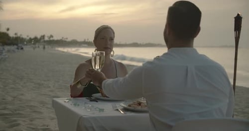 Romantic caribbean beach wedding dinner a smiling couple celebrates love together