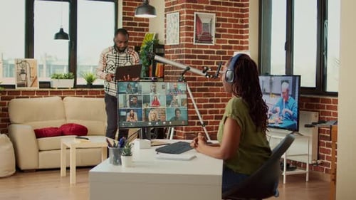 Office Worker Attending Company Meeting on Videocall