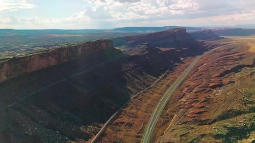 Highways and tracks going under the stunning mountains of Utah, USA