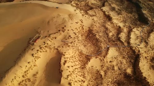 Scenic Aerial View of Coastal Desert Terrain Calm Drone Footage Capturing Erosion and Natural Forms