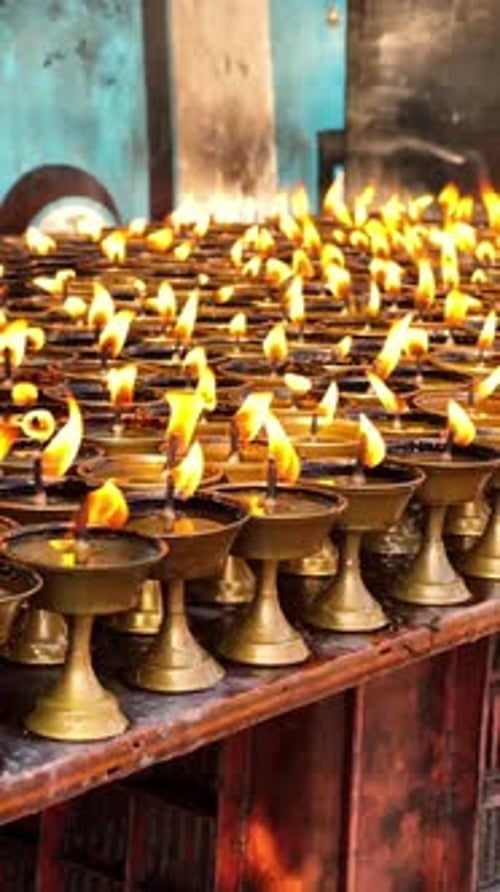 Glowing Candle Flames in Rows