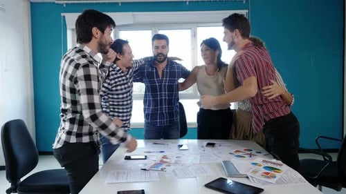 Team Celebrates Success in a Modern Office Setting