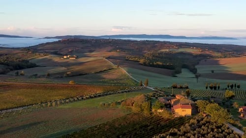 Tuscany, Italy, Aerial footage of nature landscape beautiful hills forests fields and vineyards du