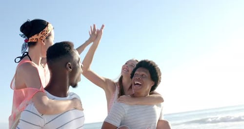Diverse friends enjoy a sunny beach day