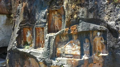 Ancient Stone Carvings in a Rock Wall
