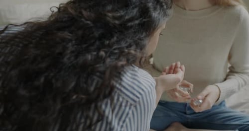 Friends Test Perfume in Cozy Home Setting