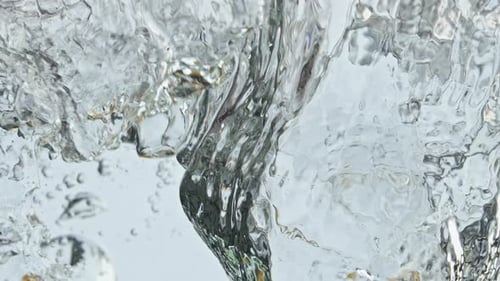 Lemon Splashes into Water creating Bubbles