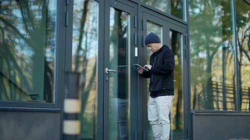 An attacker hacks into the alarm system of the entrance to a modern building or office. burglary