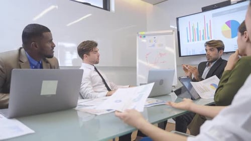 Team Having a Meeting in Bright Modern Office