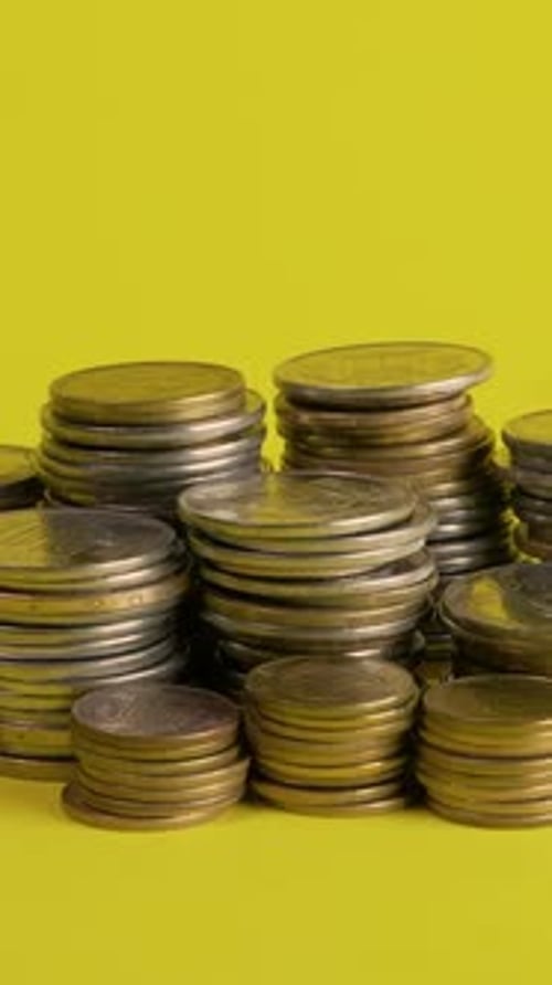 Piles of Gold and Silver Coins Accumulating
