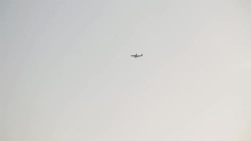 Plane flying in the sunshine.