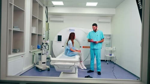 Woman getting CT scan in modern hospital