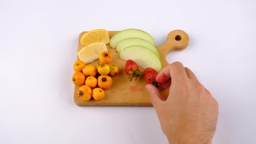 Preparing a mixed fruit platter