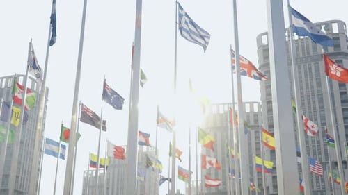 International Flags Waving in Cityscape