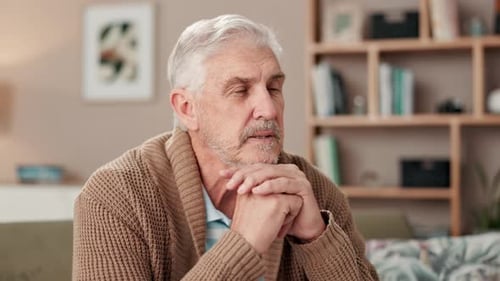 Senior Man with Gray Hair Thinking at Home