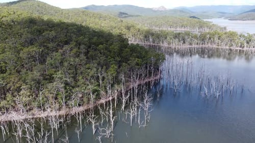 Flying over a lake towards three peninsulas