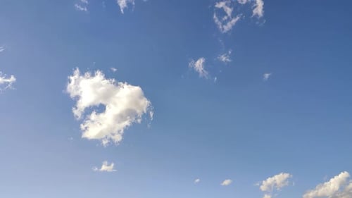 White Clouds Drifting in Clear Blue Sky