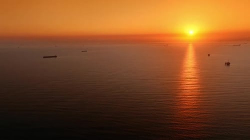 Aerial View of Golden Sunset Over Ocean