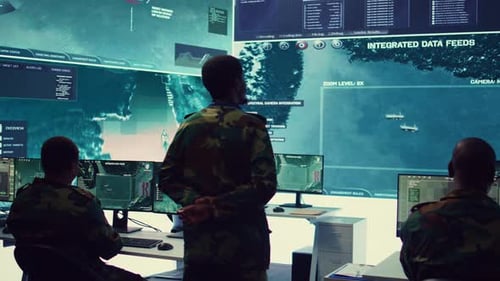 Military Personnel in Futuristic Command Center